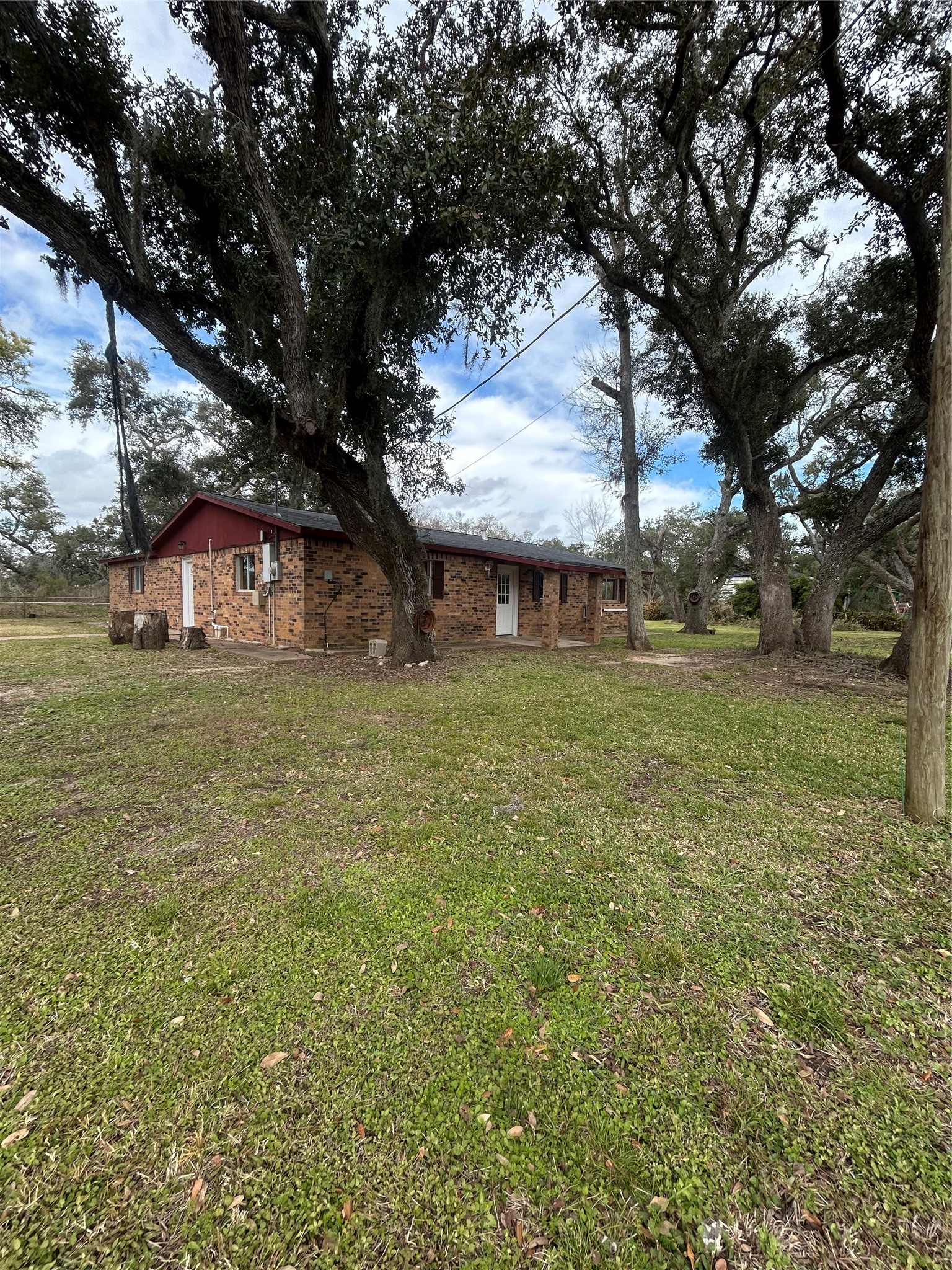 5811 East S F Austin Road Freeport, TX 77541 - Photo 4 of 26 a backyard of a house with lots of green space