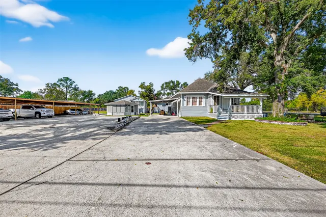 a house with swimming pool in front of it