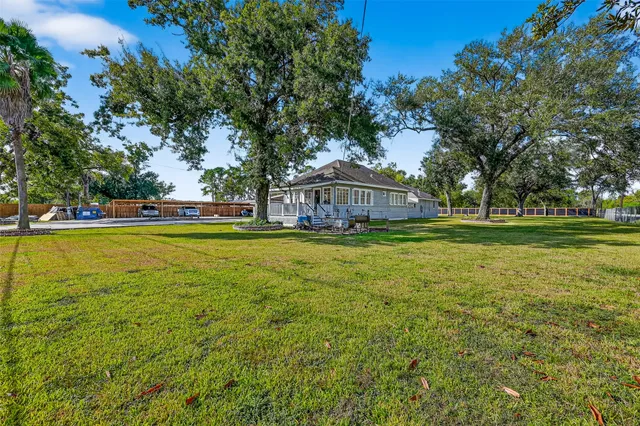 a view of a house with a big yard