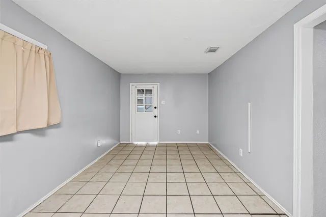 a view of an empty room and window