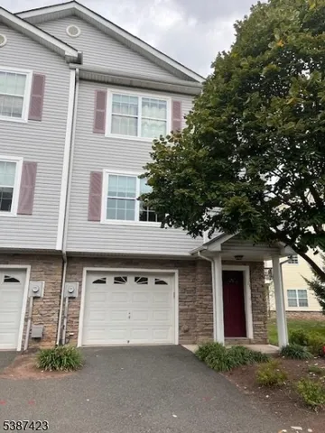 a front view of a house with yard