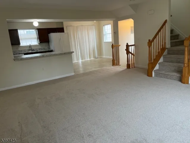 a view of a hallway with windows