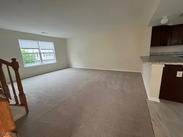 a view of livingroom with hardwood floor and a ceiling fan