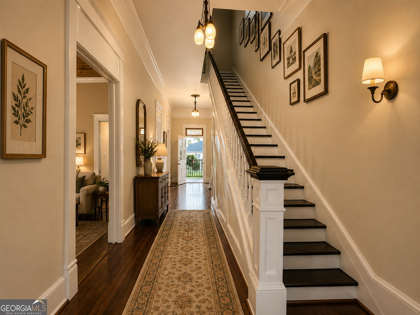316 West Church Street Fort Valley, GA 31030 - Photo 20 of 28 a view of hallway with stairs and wooden floor