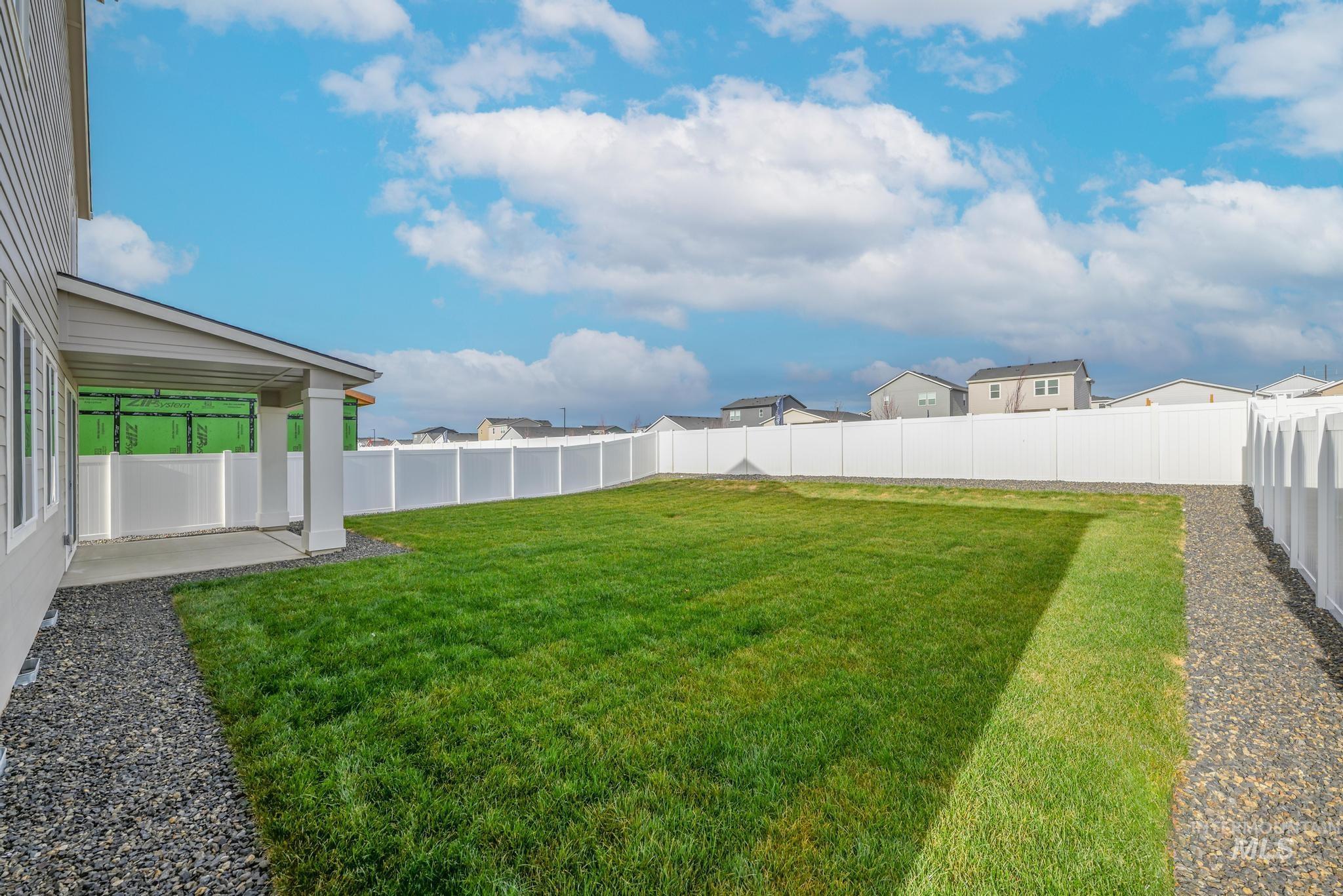 14566 Boatwatch Drive Caldwell, ID 83607 - Photo 33 of 42 Fenced backyard with a patio area and a residential view