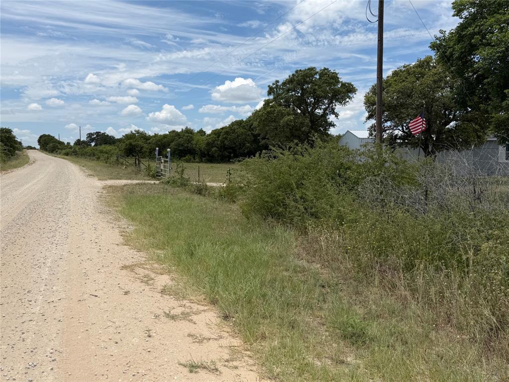 1450 County Road 240 Rising Star, TX 76471 - Photo 5 of 17 a view of a lake with a yard