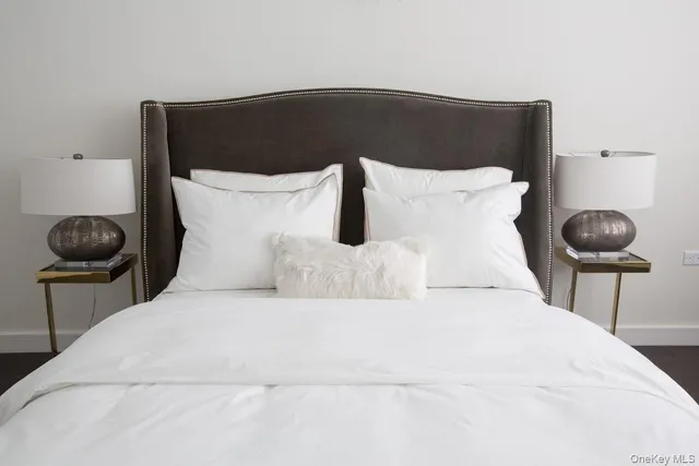 a bedroom with a bed and a chair