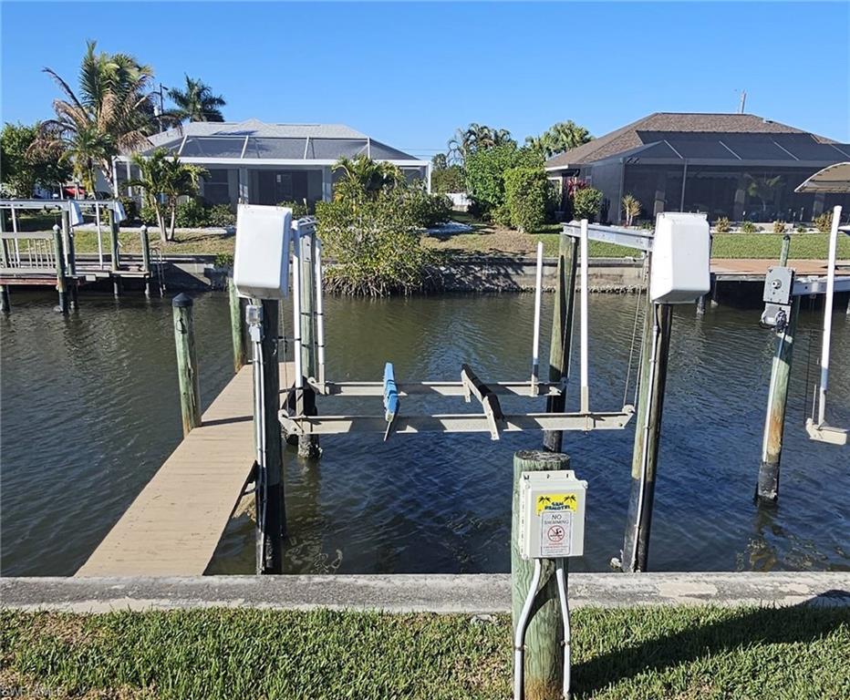 925 Southwest 47th Terrace, Unit 101 Cape Coral, FL 33914 - Photo 14 of 48 a view of a lake with sitting area