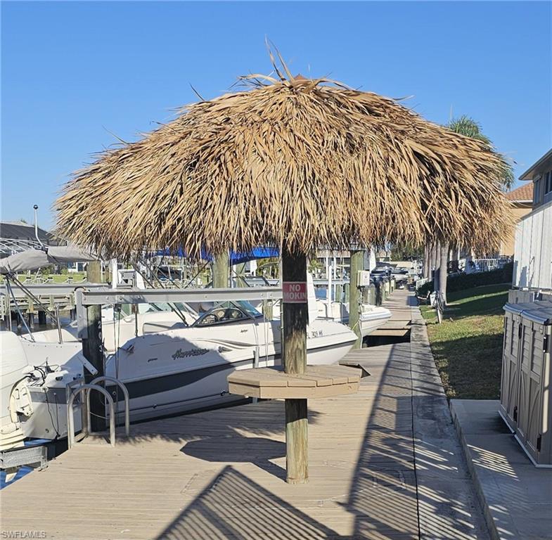 925 Southwest 47th Terrace, Unit 101 Cape Coral, FL 33914 - Photo 17 of 48 a outdoor space with patio
