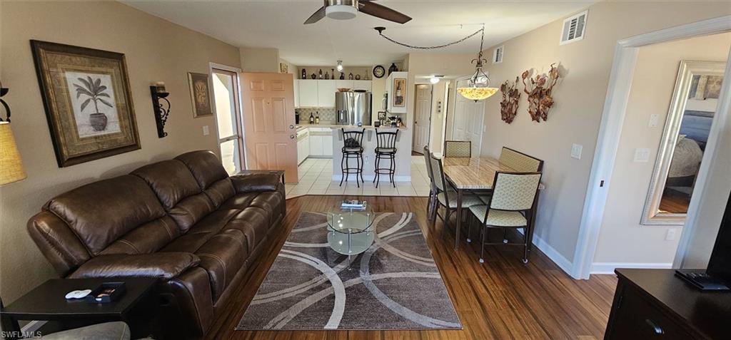 925 Southwest 47th Terrace, Unit 101 Cape Coral, FL 33914 - Photo 23 of 48 a view of a livingroom with furniture and a flat screen tv