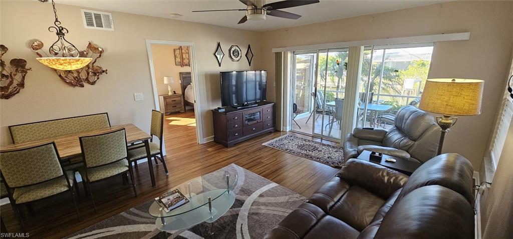 925 Southwest 47th Terrace, Unit 101 Cape Coral, FL 33914 - Photo 27 of 48 a living room with furniture and a flat screen tv