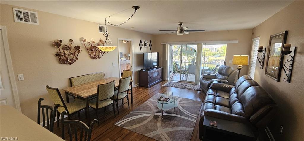 925 Southwest 47th Terrace, Unit 101 Cape Coral, FL 33914 - Photo 28 of 48 a living room with furniture and a large window