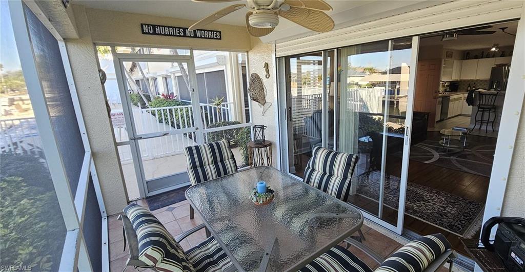 925 Southwest 47th Terrace, Unit 101 Cape Coral, FL 33914 - Photo 32 of 48 a view of a dining room with furniture window and wooden floor
