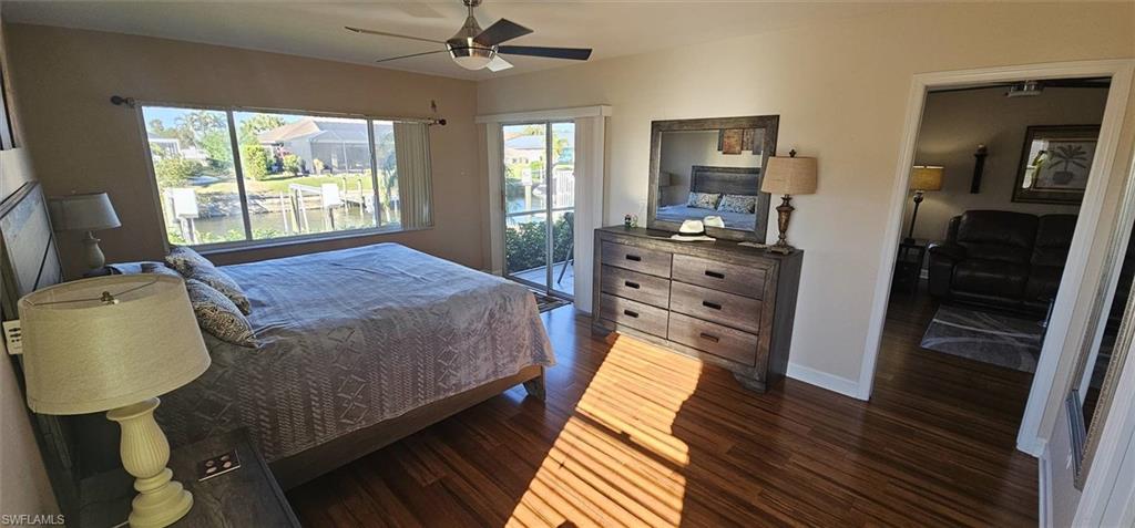 925 Southwest 47th Terrace, Unit 101 Cape Coral, FL 33914 - Photo 34 of 48 a bed sitting in a bedroom next to a window