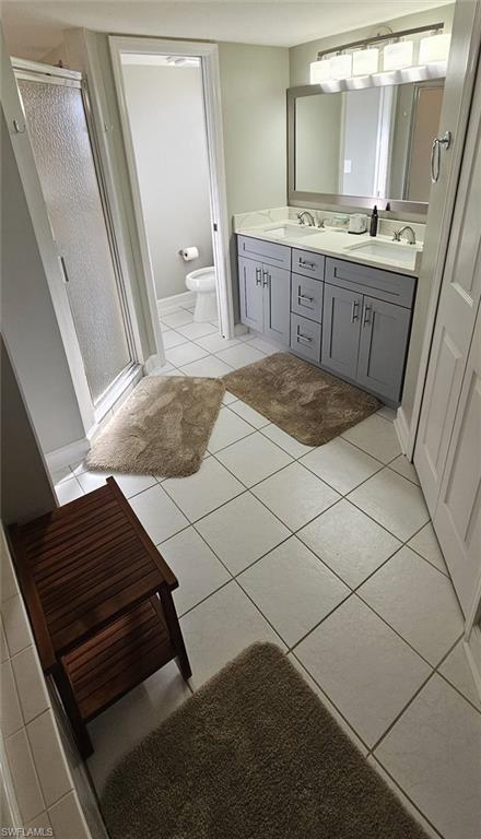 925 Southwest 47th Terrace, Unit 101 Cape Coral, FL 33914 - Photo 35 of 48 a bathroom with a sink and a mirror