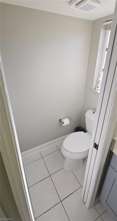 925 Southwest 47th Terrace, Unit 101 Cape Coral, FL 33914 - Photo 37 of 48 a white toilet sitting next to a shower