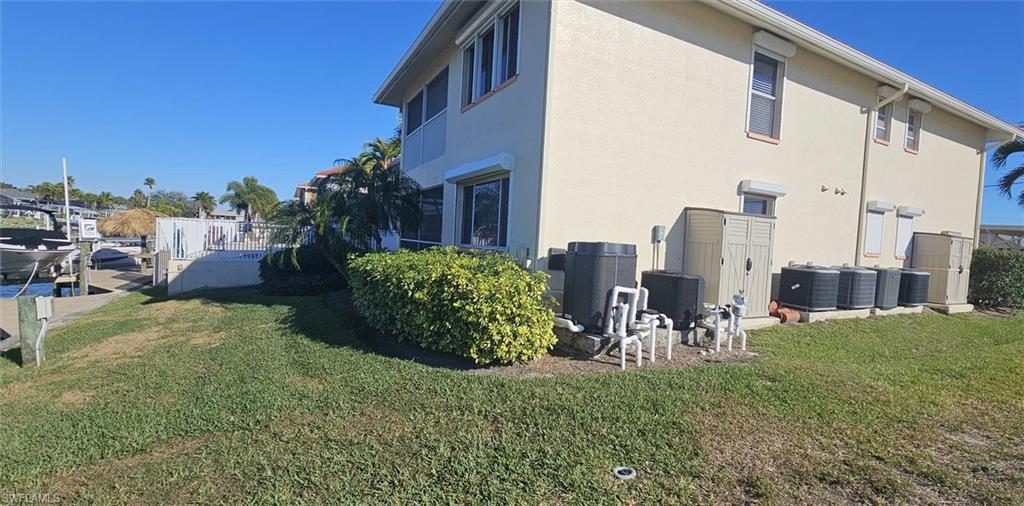 925 Southwest 47th Terrace, Unit 101 Cape Coral, FL 33914 - Photo 5 of 48 a view of a chairs in front of a house