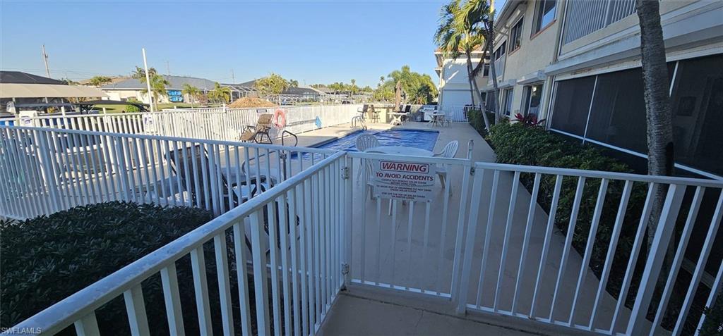 925 Southwest 47th Terrace, Unit 101 Cape Coral, FL 33914 - Photo 7 of 48 a view of a balcony with wooden fence