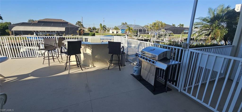 925 Southwest 47th Terrace, Unit 101 Cape Coral, FL 33914 - Photo 9 of 48 a view of a balcony with city view
