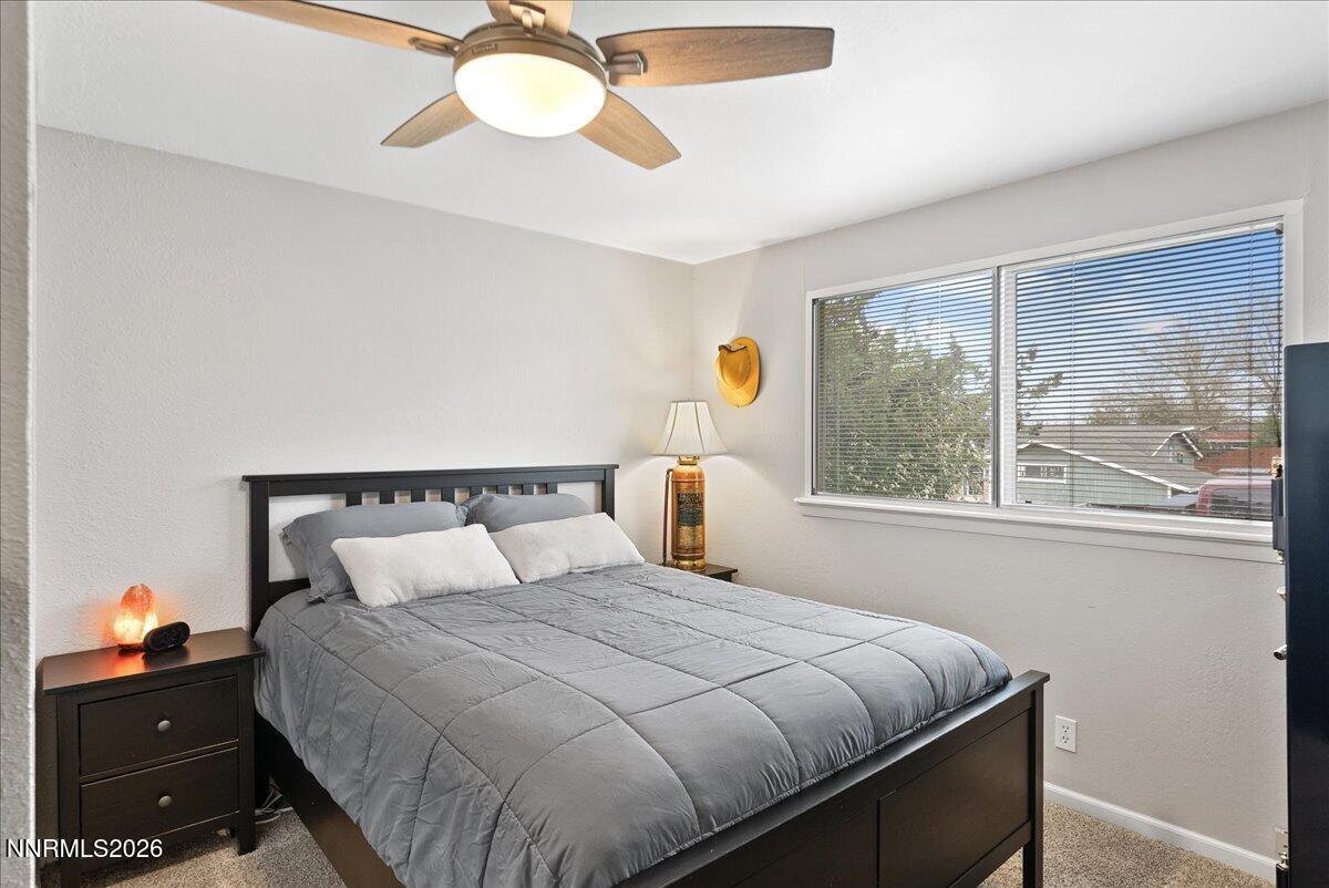 2205 Carlin Street Reno, NV 89503 - Photo 24 of 51 a bedroom with a bed and window