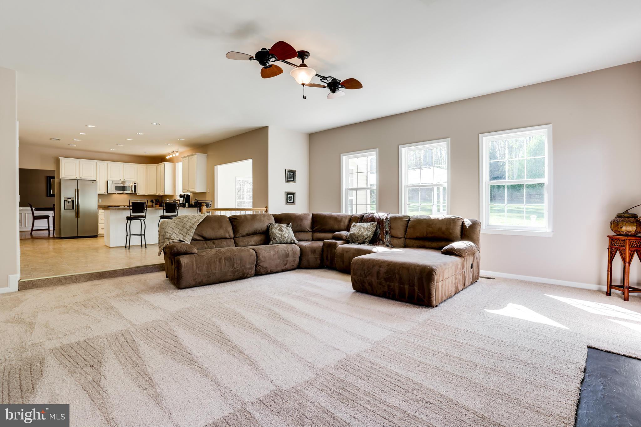 6814 North Stuart Road King George, VA 22485 - Photo 13 of 30 a living room with furniture kitchen view and a window