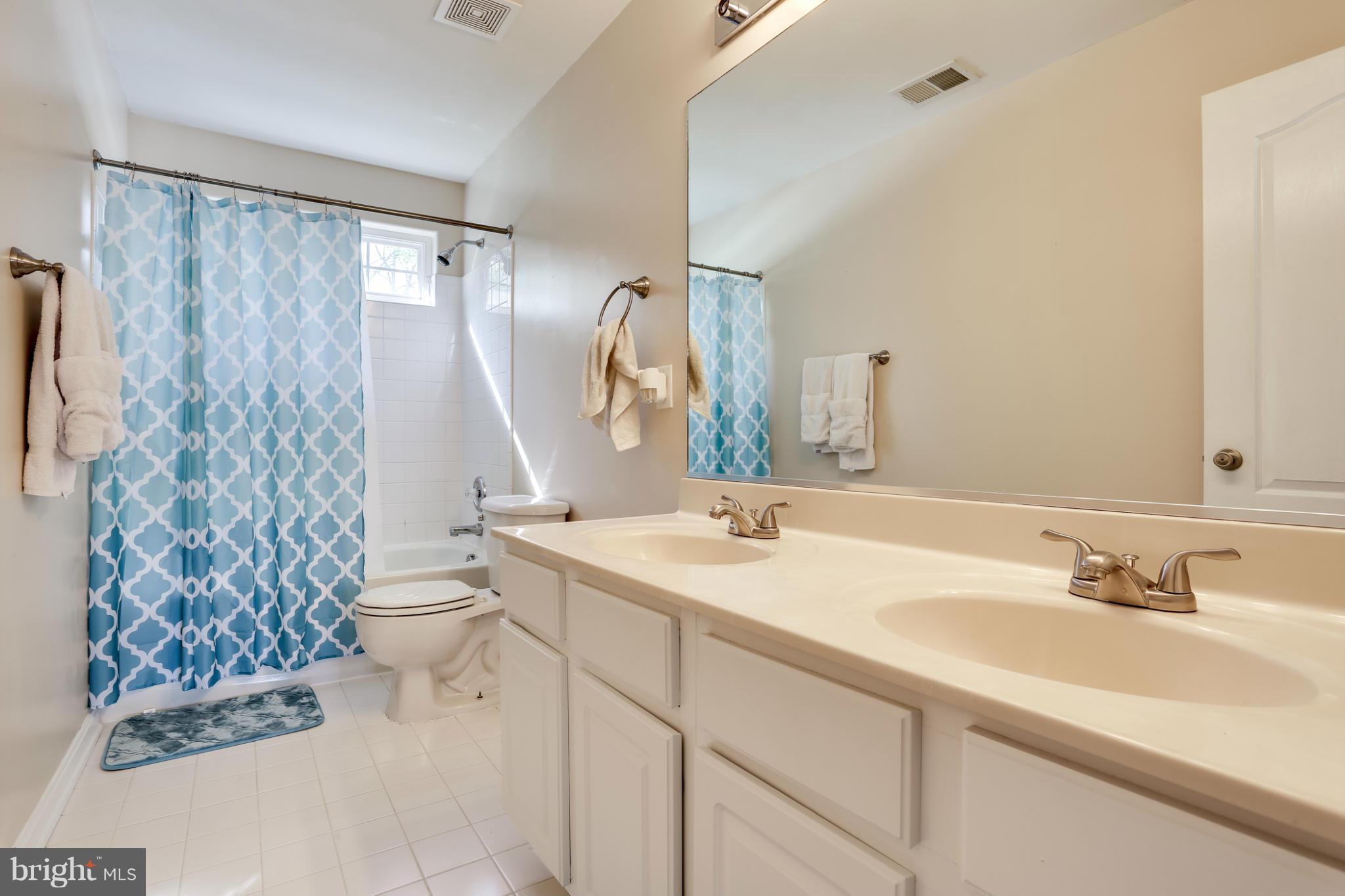 6814 North Stuart Road King George, VA 22485 - Photo 19 of 30 a bathroom with a sink toilet and shower