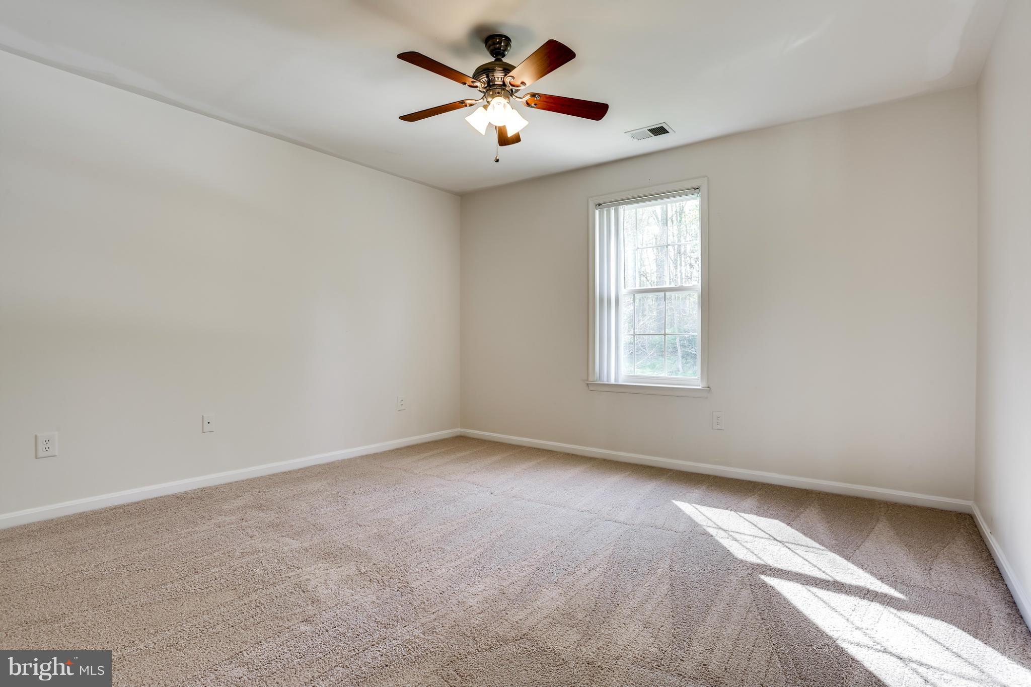 6814 North Stuart Road King George, VA 22485 - Photo 20 of 30 a view of an empty room with a window