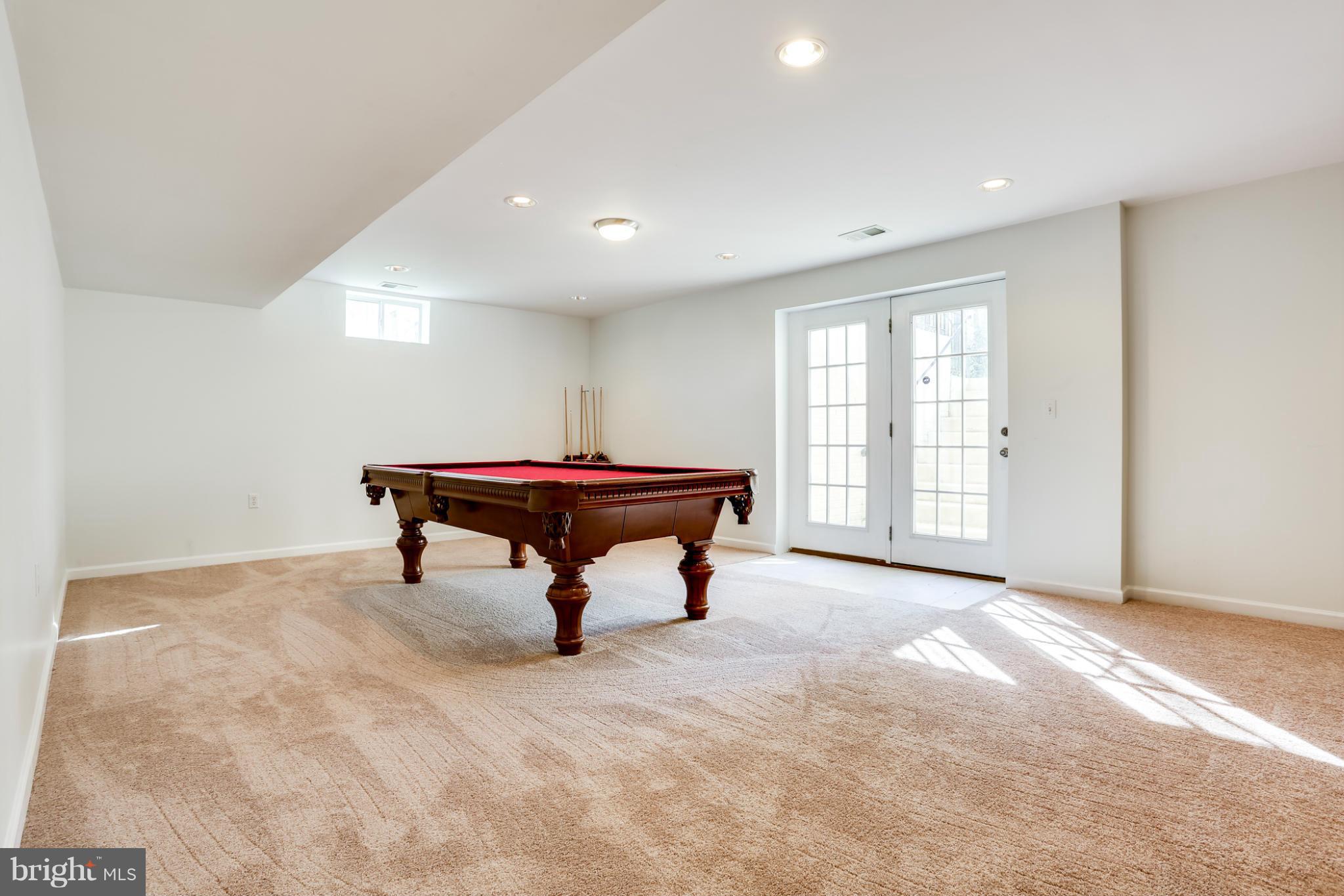6814 North Stuart Road King George, VA 22485 - Photo 26 of 30 a room with pool table and windows