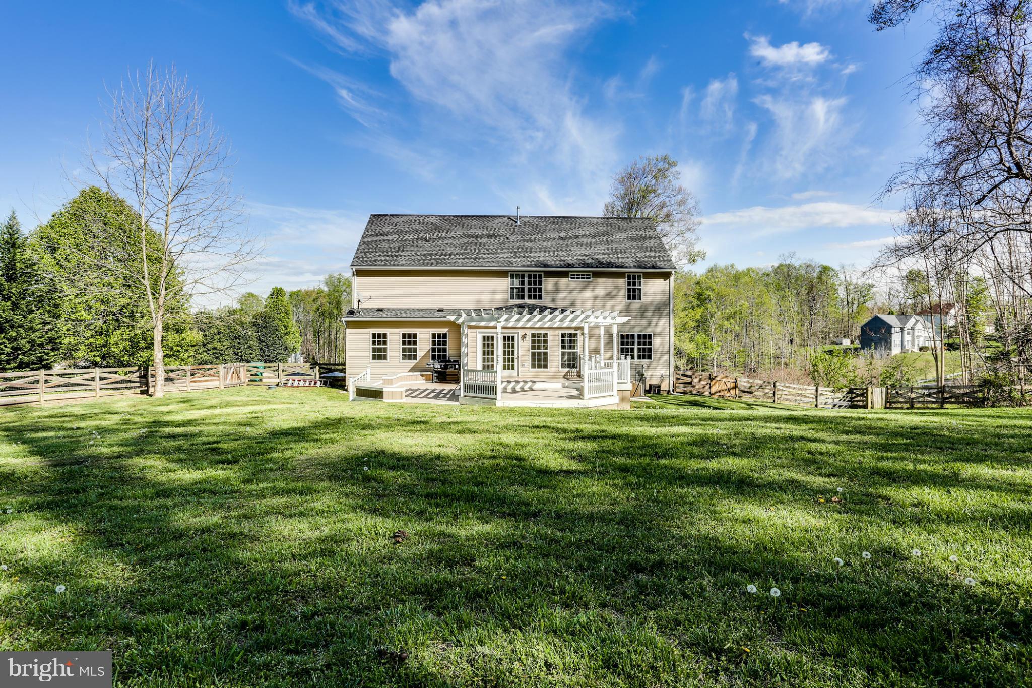 6814 North Stuart Road King George, VA 22485 - Photo 30 of 30 a front view of a house with a garden