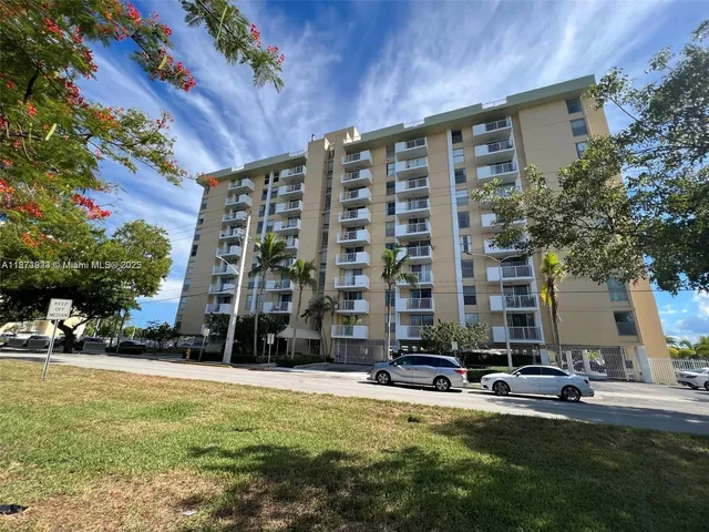 a front view of building with yard