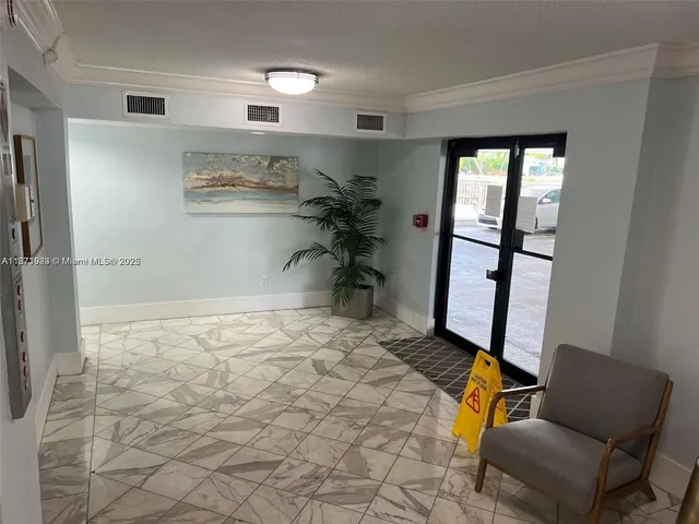 a bed room with a bed and a chair