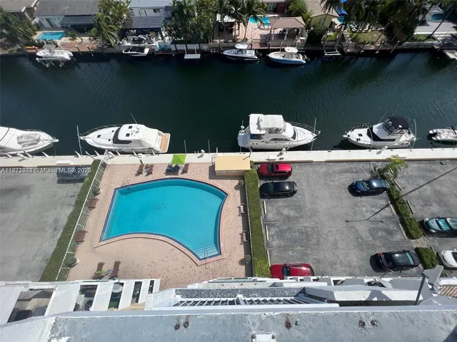 an aerial view of a house with a lake view