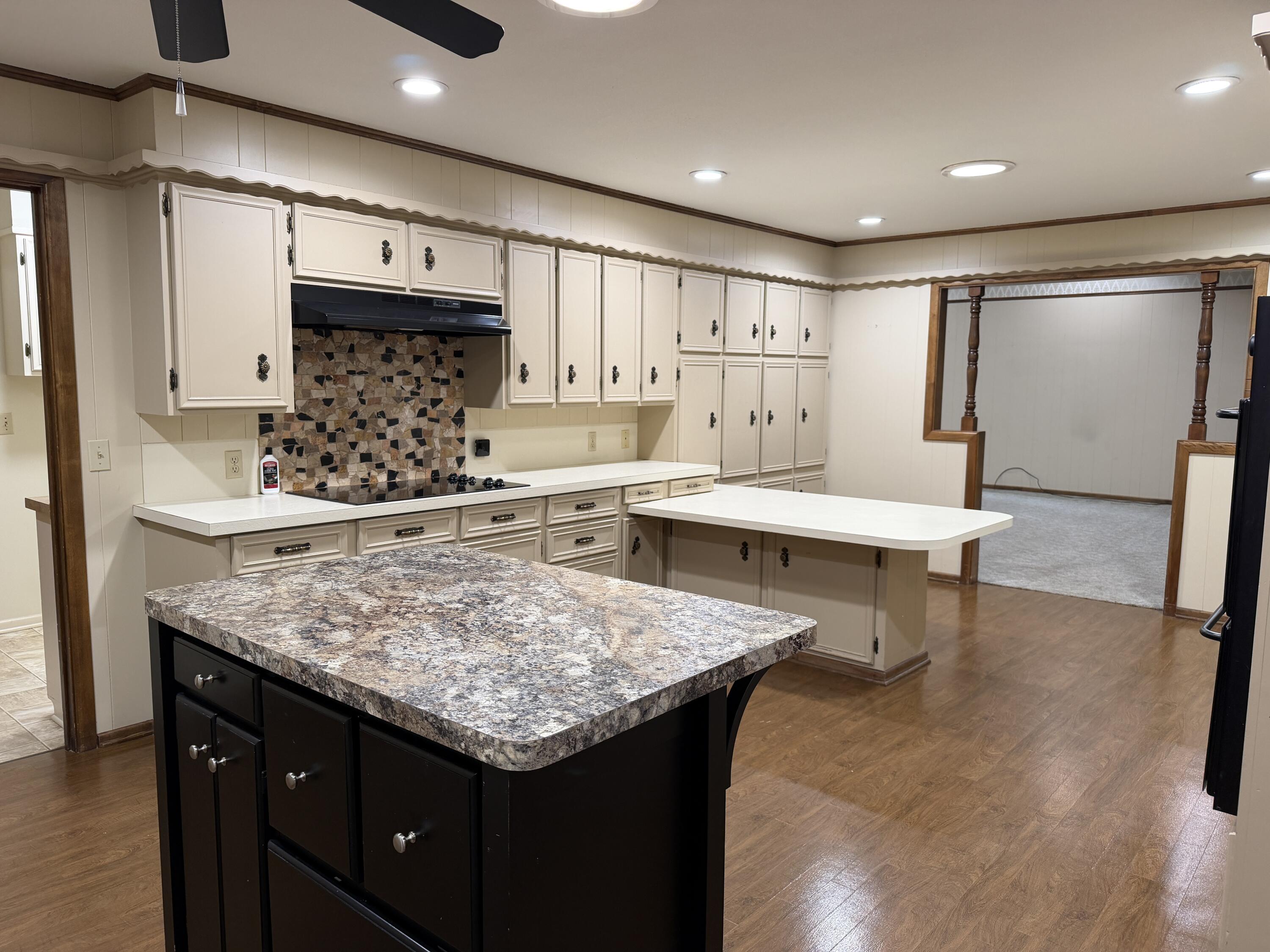 1603 South 8th Street Lamesa, TX 79331 - Photo 5 of 39 a kitchen with a table and chairs in it