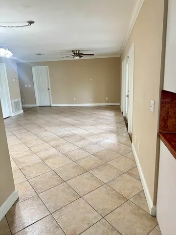 a view of a room with white walls