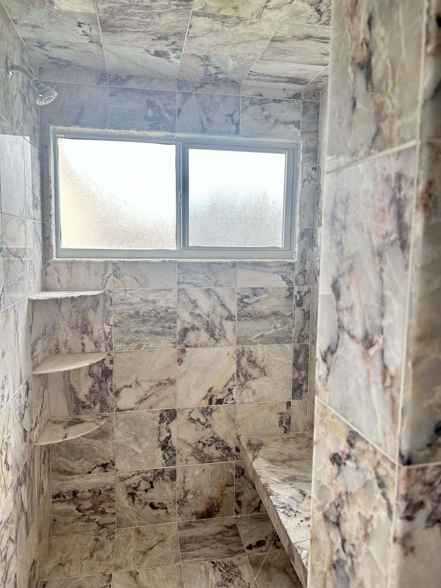 383 Southwest Tulip Boulevard Port St. Lucie, FL 34953 - Photo 15 of 26 a bathroom with a window