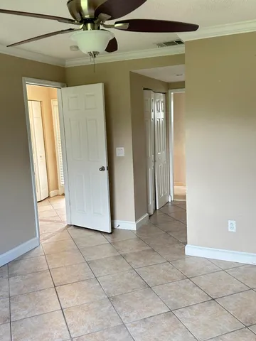a view of a hallway with entryway and window