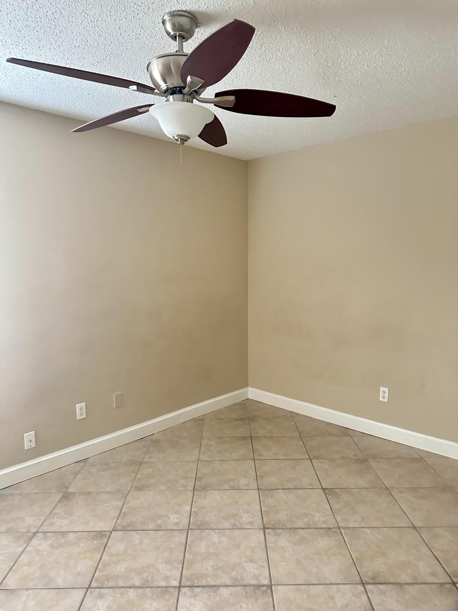 383 Southwest Tulip Boulevard Port St. Lucie, FL 34953 - Photo 20 of 26 a view of an empty room