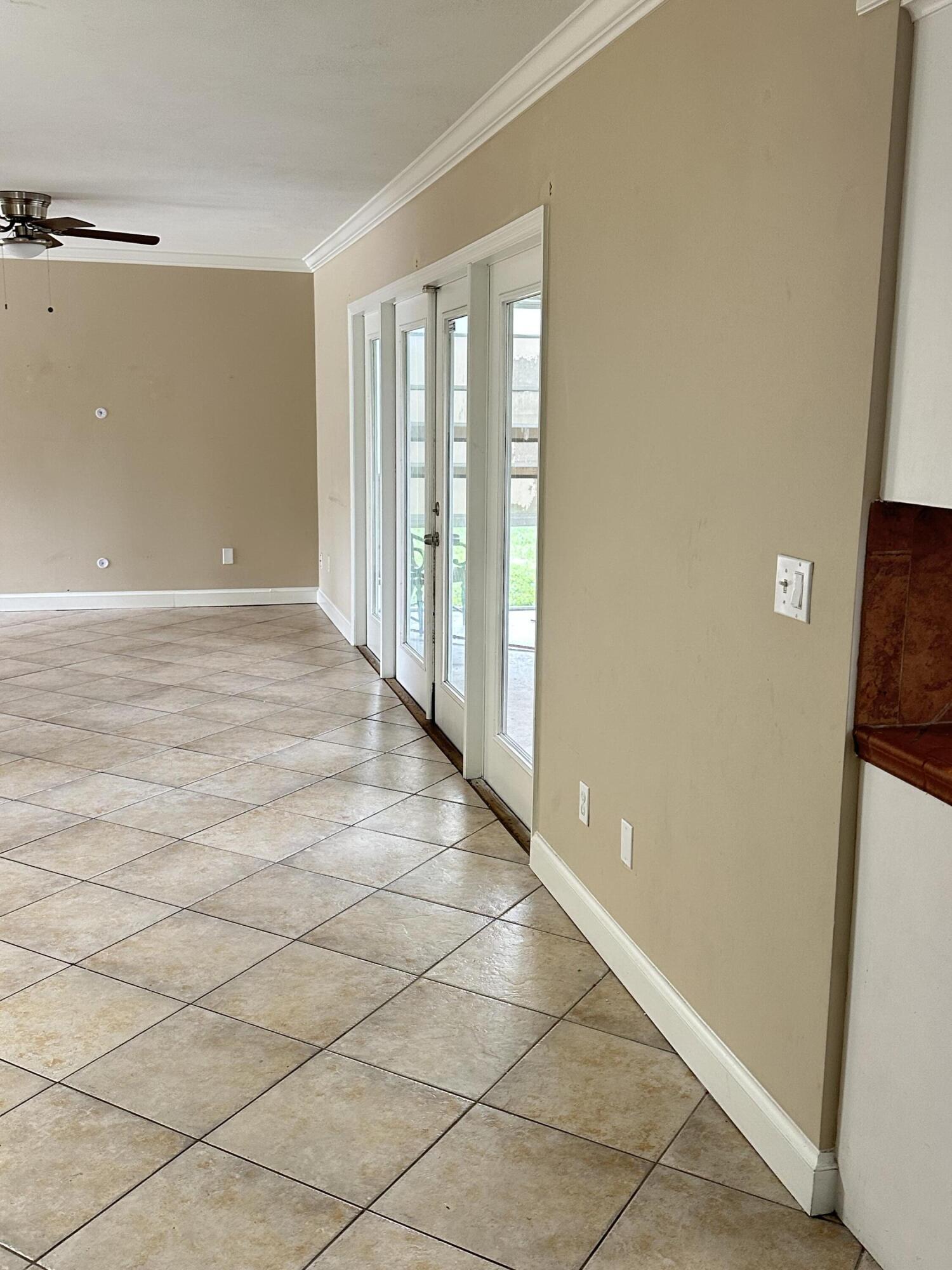 383 Southwest Tulip Boulevard Port St. Lucie, FL 34953 - Photo 23 of 26 a view of an empty room and window