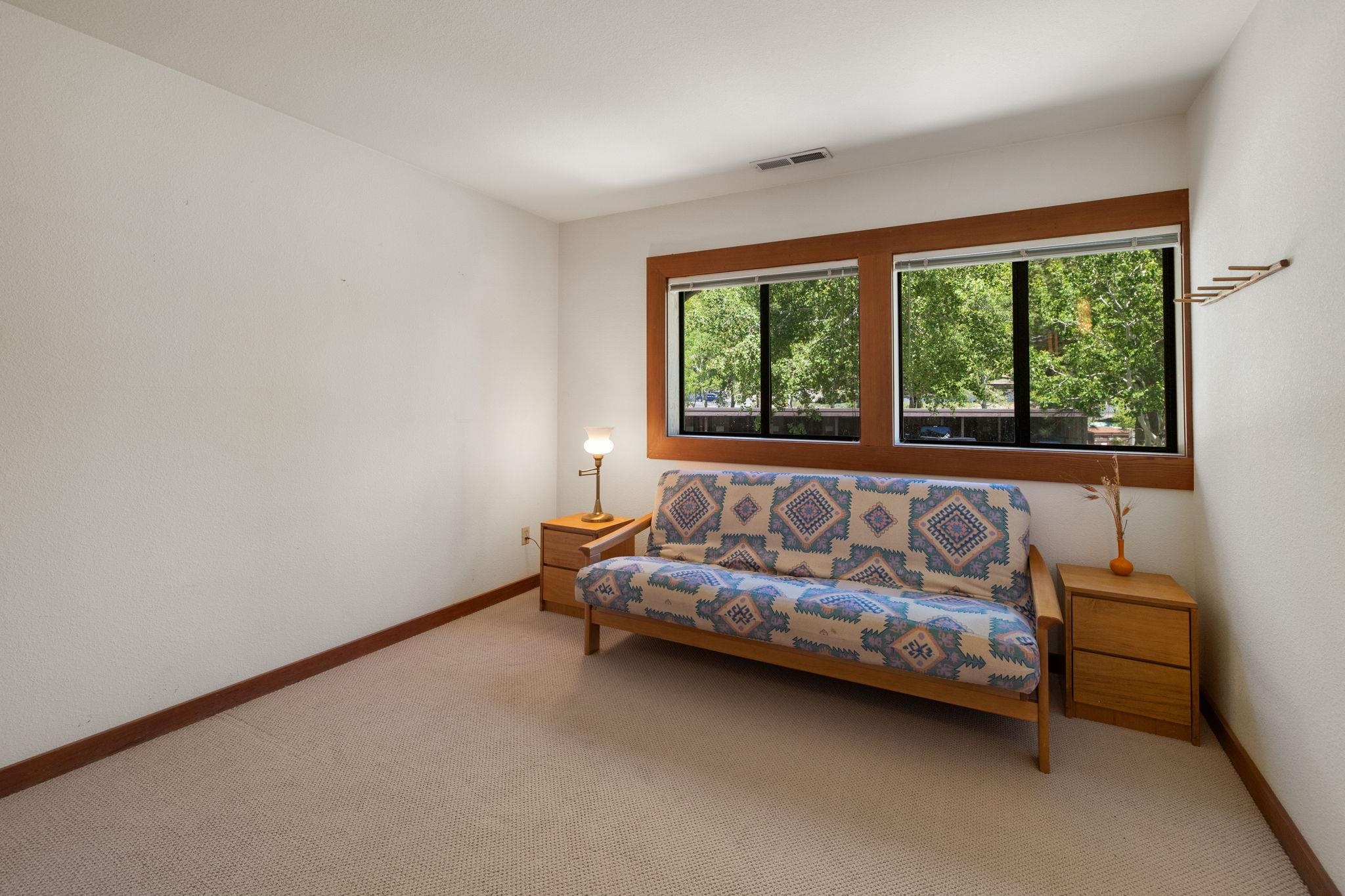 1591 Olympic Vly Road, Unit 29 Olympic Valley, CA 96146 - Photo 17 of 28 a living room with furniture and a window