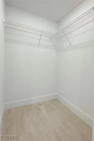 an empty room with window and windows