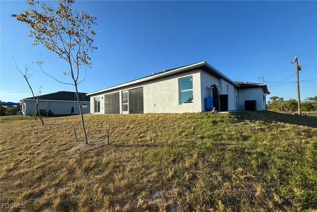an aerial view of a house with a swimming pool