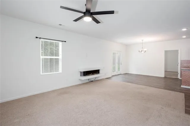 a view of a kitchen with a sink and a refrigerator