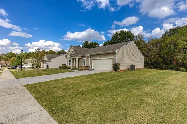a view of a backyard with large trees