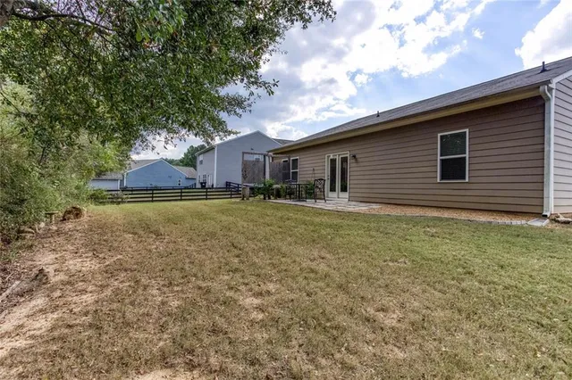 a view of outdoor space with deck and trees