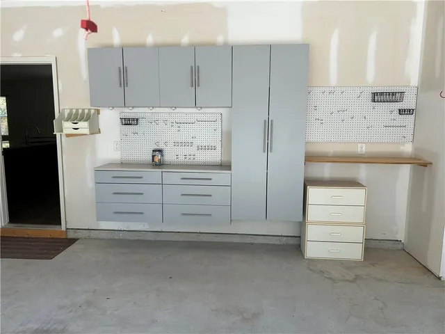 a kitchen with a refrigerator and mirror