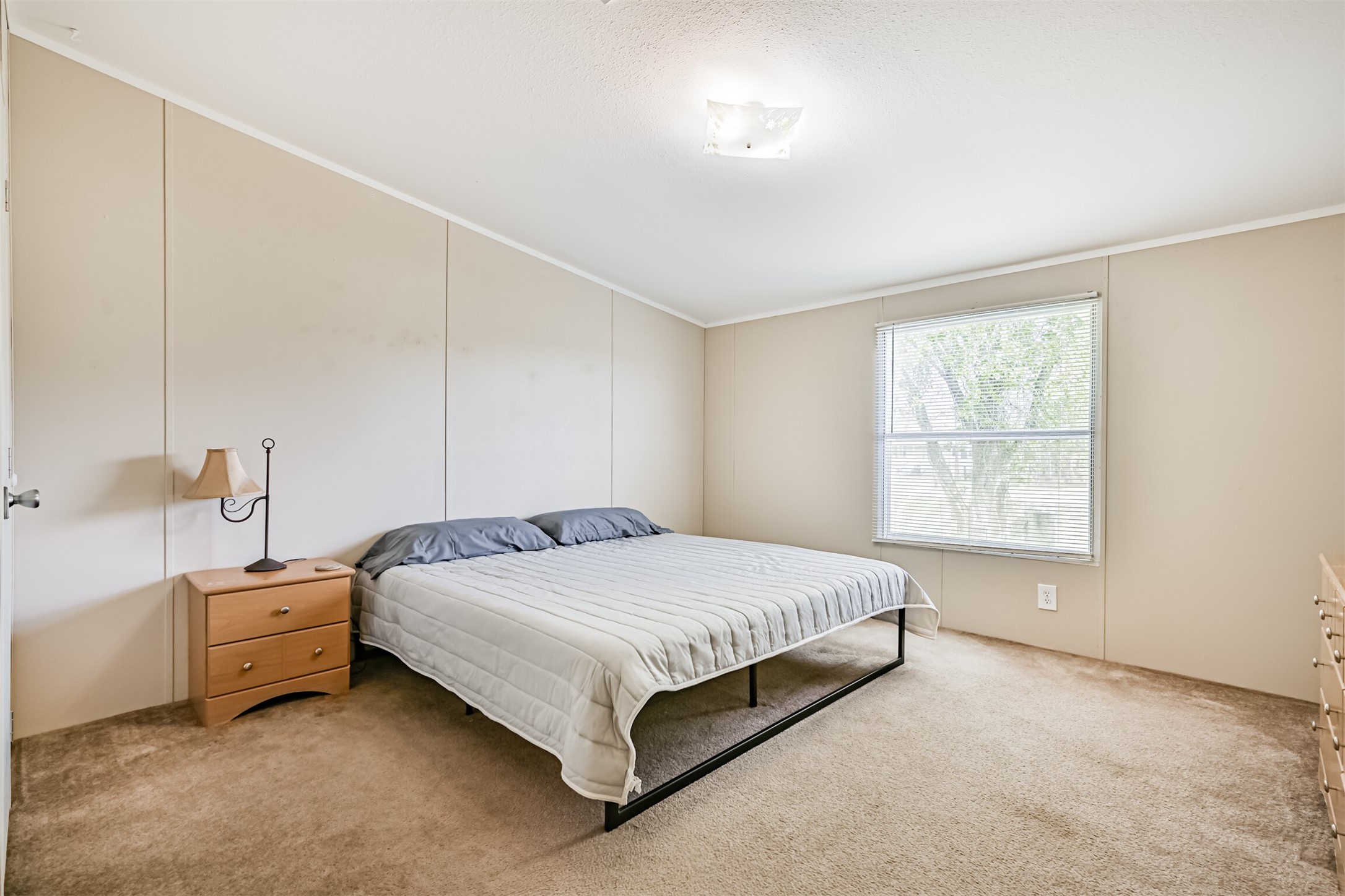 1036 9th Street Dickinson, TX 77539 - Photo 11 of 29 a bedroom with a bed and a window
