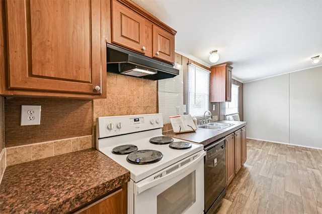 a kitchen with a stove and a sink