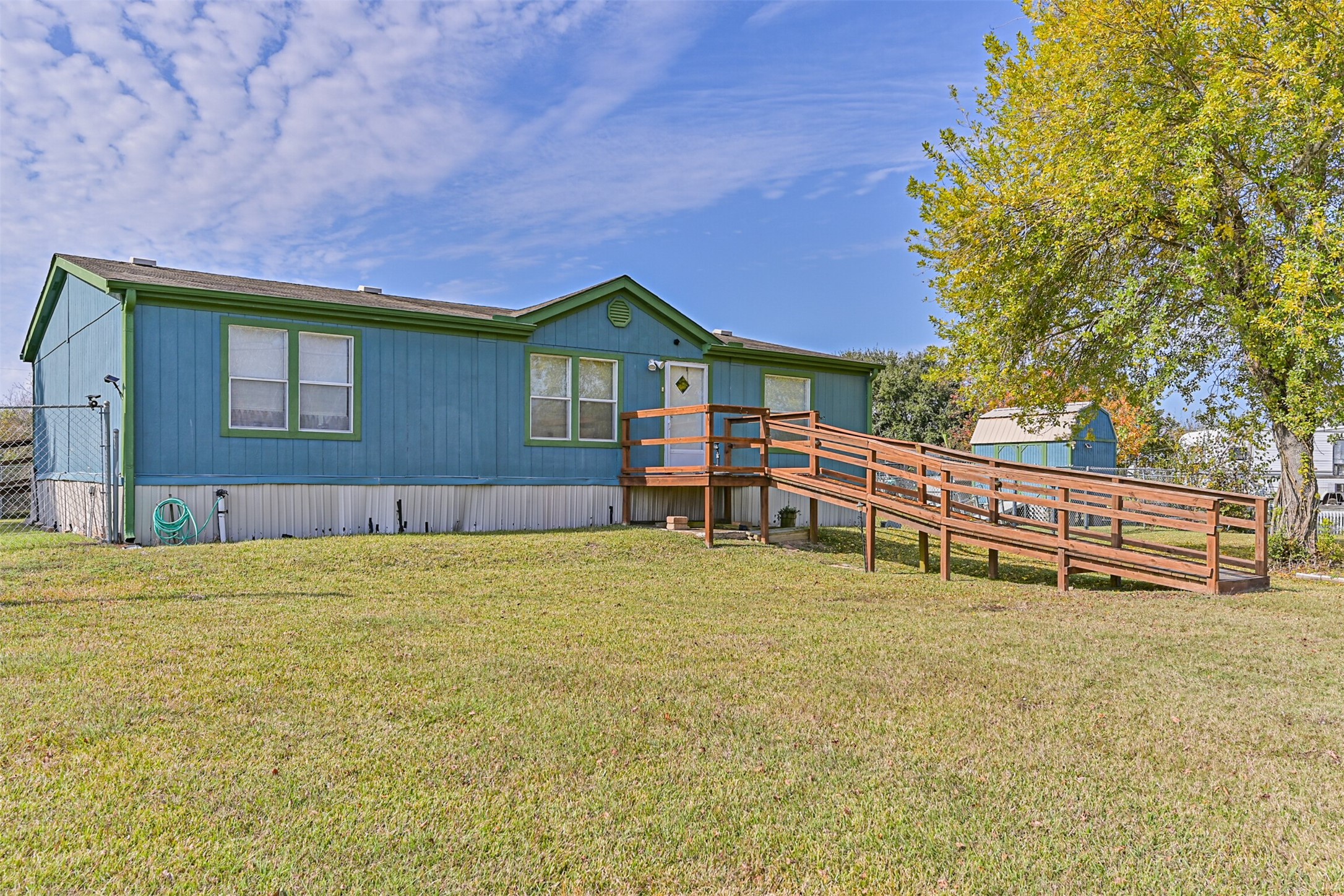1036 9th Street Dickinson, TX 77539 - Photo 2 of 29 a backyard of a house with table and chairs