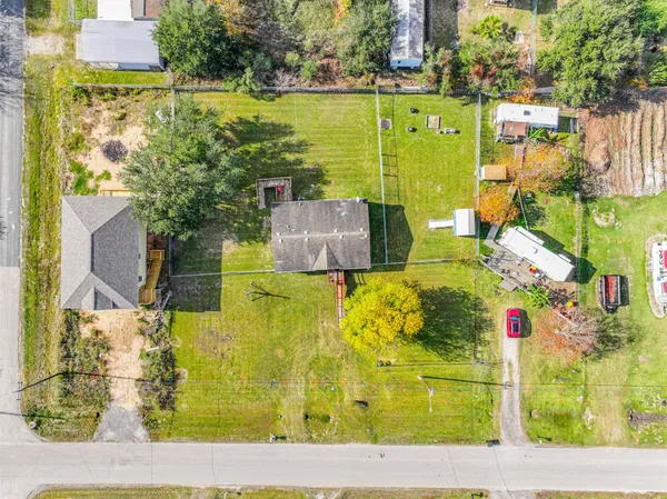 an aerial view of residential houses with outdoor space