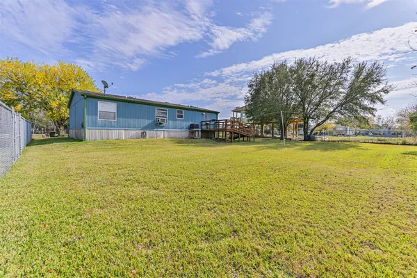 a view of a swimming pool with an outdoor space and seating area